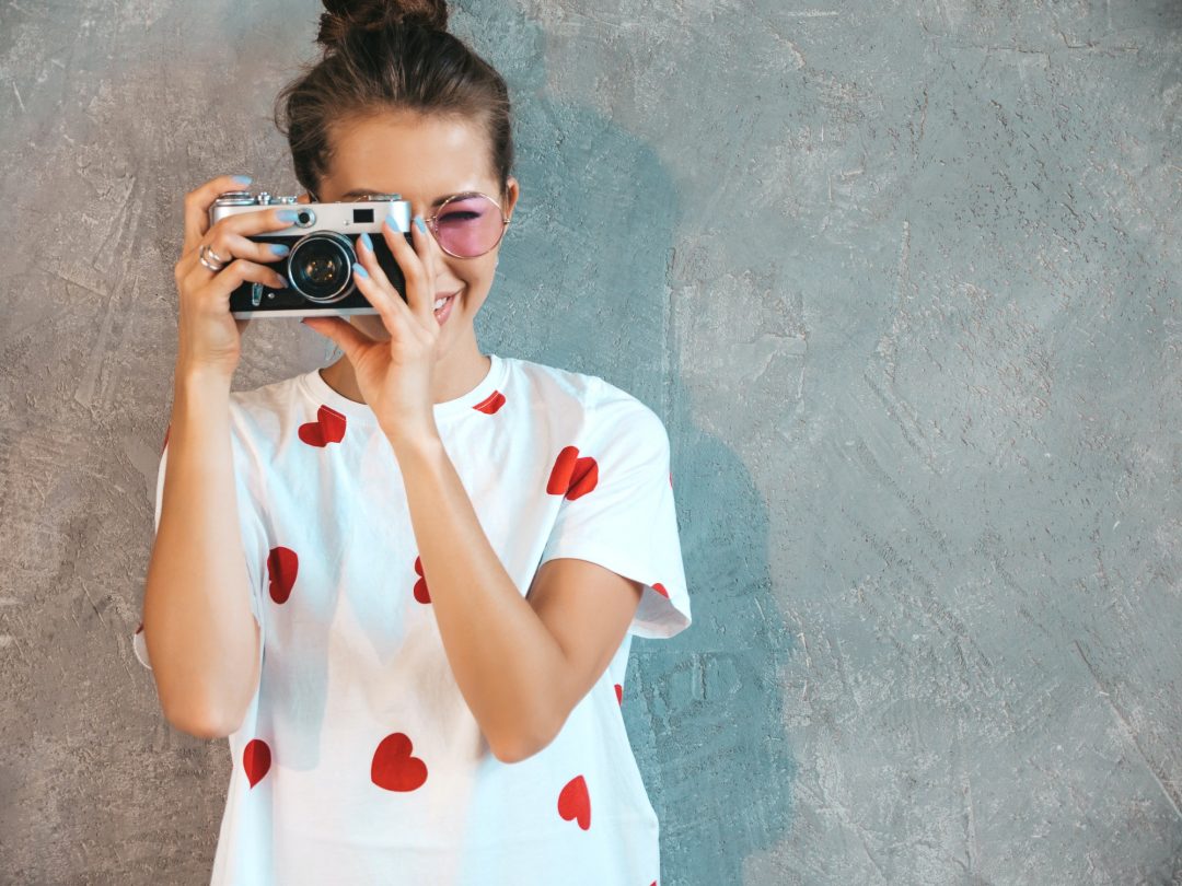 Portrait of young beautiful woman posing in studio